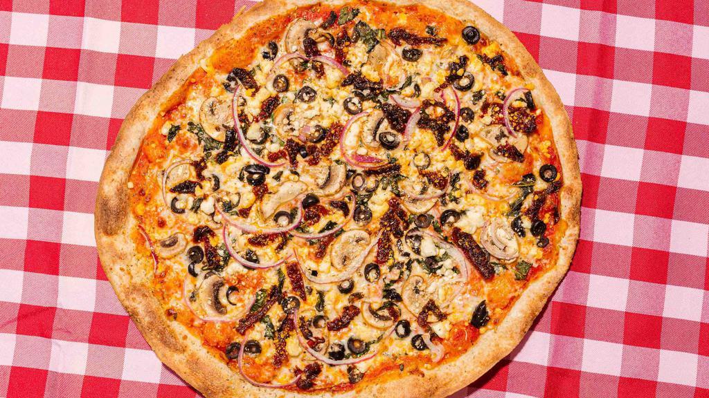 Tuscan Veggie Pizza · Red sauce, four cheese blend, fresh basil, red onion, mushrooms, olives, goat cheese, and sun-dried tomatoes.