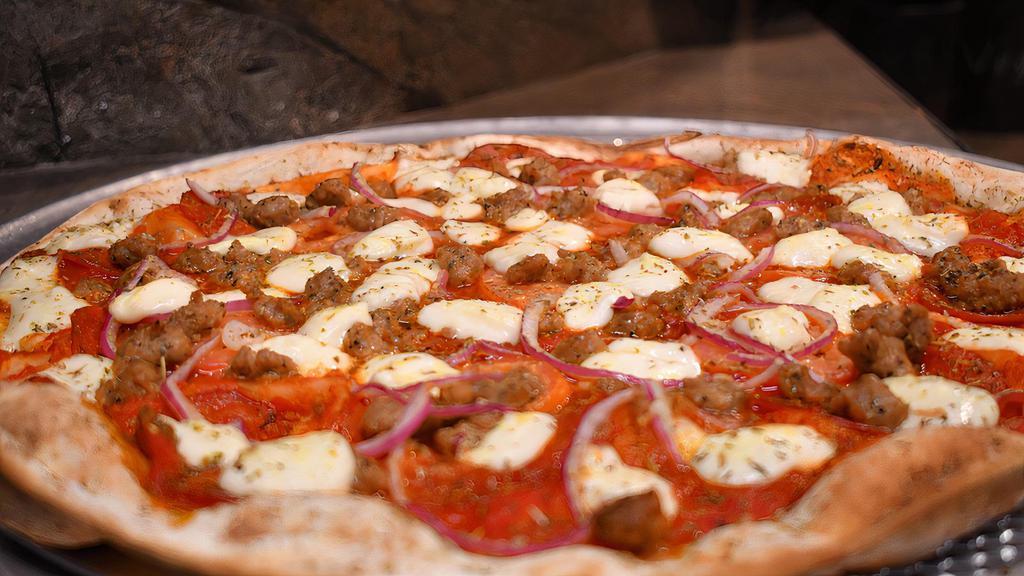 Carne Amante Pizza · Tomato sauce, smoked pepperoni, fresh mozzarella, classic pepperoni, Italian sausage, red onion, and fresh roma tomatoes.