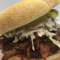 Buffalo Chop Sandwich · pulled pork and beef brisket tossed in our house Buffalo sauce, topped with creamy coleslaw,...