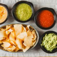 Three Amigos · Fresh lime-juice-sprinkled tortilla chips, with our three cheese queso, fresh guacamole, and...
