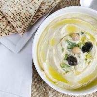 Hummus · Garbanzo beans, fresh garlic, tahini blended together and topped with extra virgin olive oil...