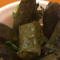 Dolma · stuffed grape leaves with rice and seasoned vegetables, cooked with lemon and extra virgin o...