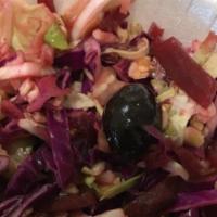 Cabbage Salad · Red and white cabbage mixed with red beats and dry crushed mint topped with pomegranate mola...