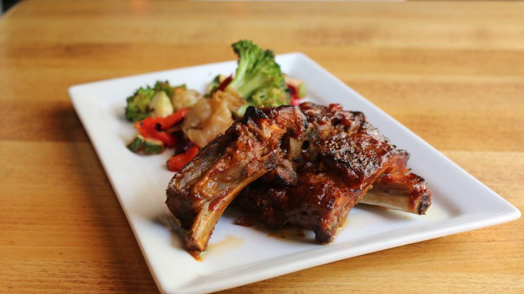 Bbq Baby Back Pork Ribs · Gluten-Free. Tender spice-rubbed Baby Back Ribs with Southwestern zesty BBQ sauce.