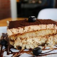 Tiramisu · Classic italian coffee-flavored creamy layered cake.