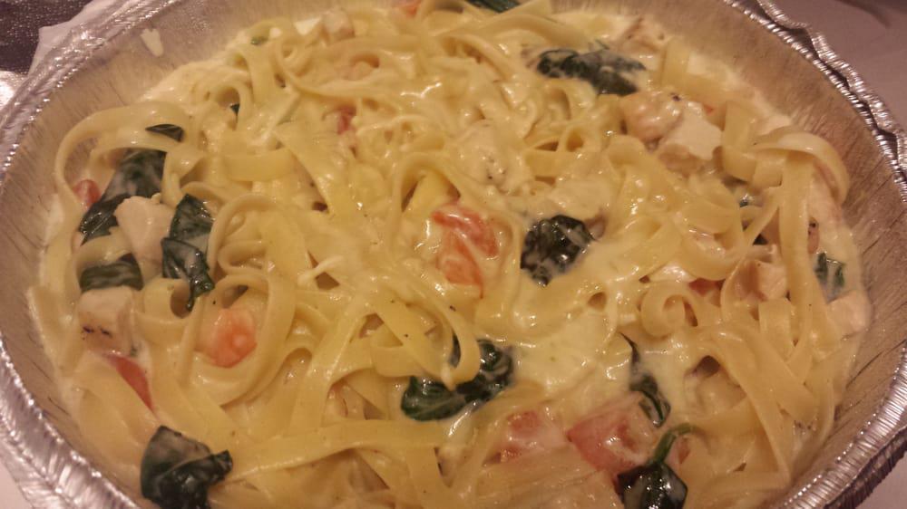 Padrino’S Fettuccini · Fettuccini pasta in creamy alfredo sauce with chicken, spinach, and chopped tomatoes.