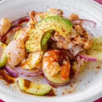 Tostada Especial · Aguachile, scallops, pulpo, cooked shrimp marinated in lime juice and our signature hot sauce