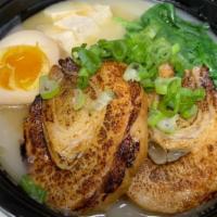 Tonkotsu Chashu Pork Ramen · Japanese braised Pork, Bamboo shoots, Sprouts, Baby Spinach, Soft-boiled egg, Tofu.