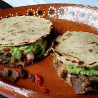 Mulitas X 2 · 2 Toasted Corn Tortillas with melted mozzarella cheese guacamole and meat