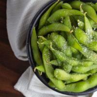 Edamame · Freshly steamed soybeans served warm and topped with sea salt.