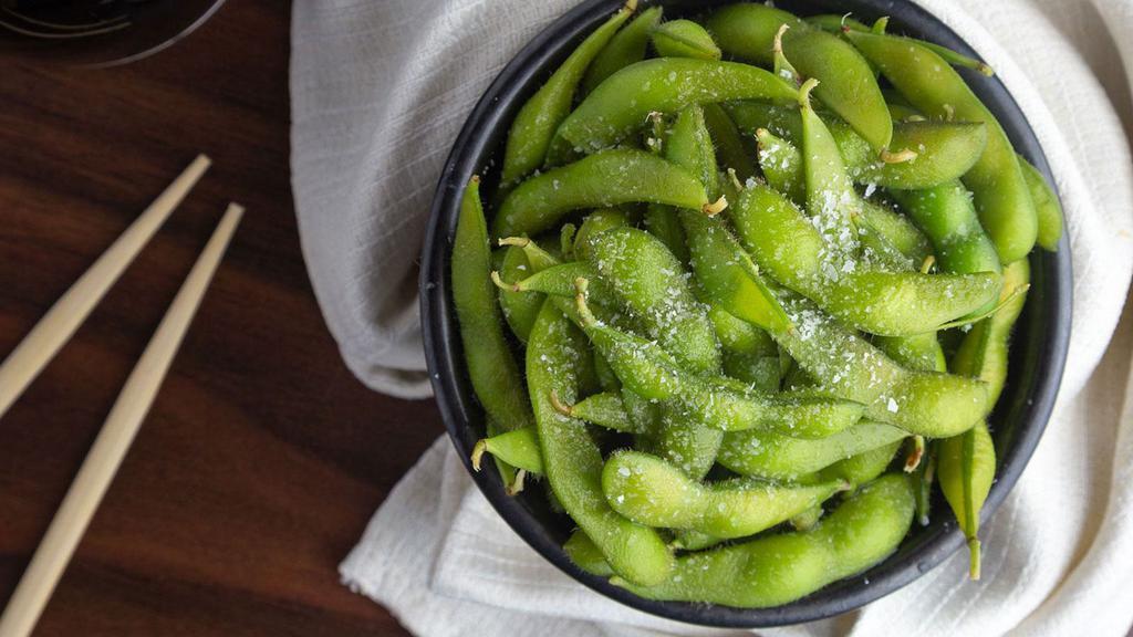 Edamame · Freshly steamed soybeans served warm and topped with sea salt.