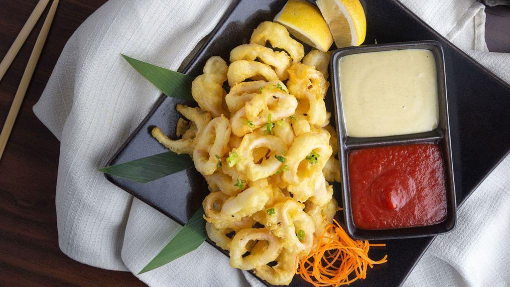 Crispy Calamari · Our famous calamari tempura dipped and served with wasabi aioli and sweet cocktail sauce.
