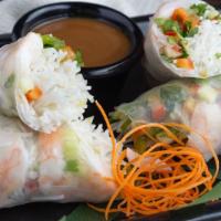 Shrimp Summer Rolls · Shrimp, seasonal veggies and noodles wrapped in rice paper served chilled with spicy Thai pe...