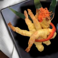 Tiger Prawns · Tiger Prawns, lightly battered and tempura dipped. Served with a sweet chili dipping sauce. ...