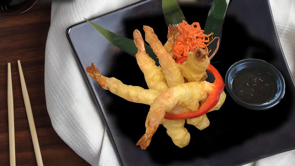 Tiger Prawns · Tiger Prawns, lightly battered and tempura dipped. Served with a sweet chili dipping sauce. (5)