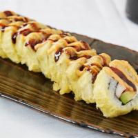 Vegas Roll · Salmon, crab, avocado and cream cheese, tempura dipped, topped with sumo sauce and sweet sau...