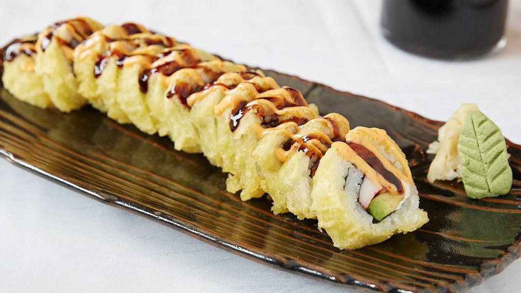 Vegas Roll · Salmon, crab, avocado and cream cheese, tempura dipped, topped with sumo sauce and sweet sauce.