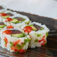 Baja Roll · Spicy tuna, avocado and cilantro topped with jalapenos and sriracha sauce.