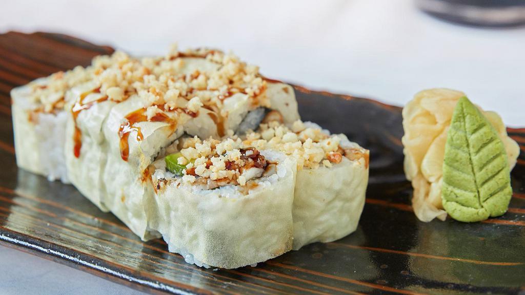 Diva Roll · Unagi (freshwater eel), cream cheese, avocado and macadamia nuts rolled in soy paper and topped with sweet sauce.