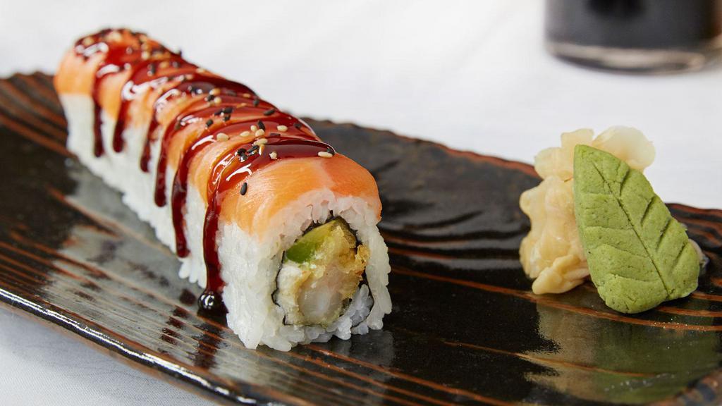 Samurai Roll · Tempura shrimp, avocado and cream cheese topped with salmon sashimi, sweet sauce and sesame seeds.