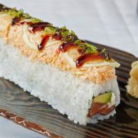 Rising Sun Roll · Salmon, avocado and cream cheese topped with spicy crab, green onions, lemon and sweet sauce.