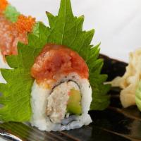 Dragon Roll · Crab and avocado topped with shrimp, spicy tuna, ebi and tobiko.