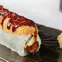 Brooklyn Roll · Spicy tuna, inari, avocado and cucumber topped with spicy crab, tobiko and sweet sauce.