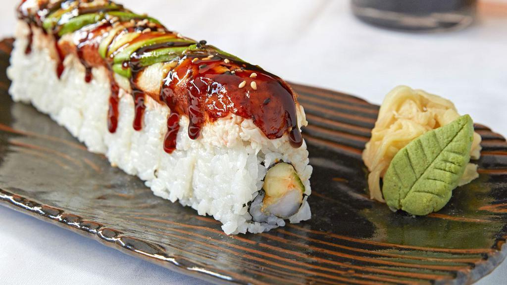 Mia Roll · Tempura shrimp, cucumber and sumo sauce topped with crab salad, freshwater eel, avocado and sweet sauce.