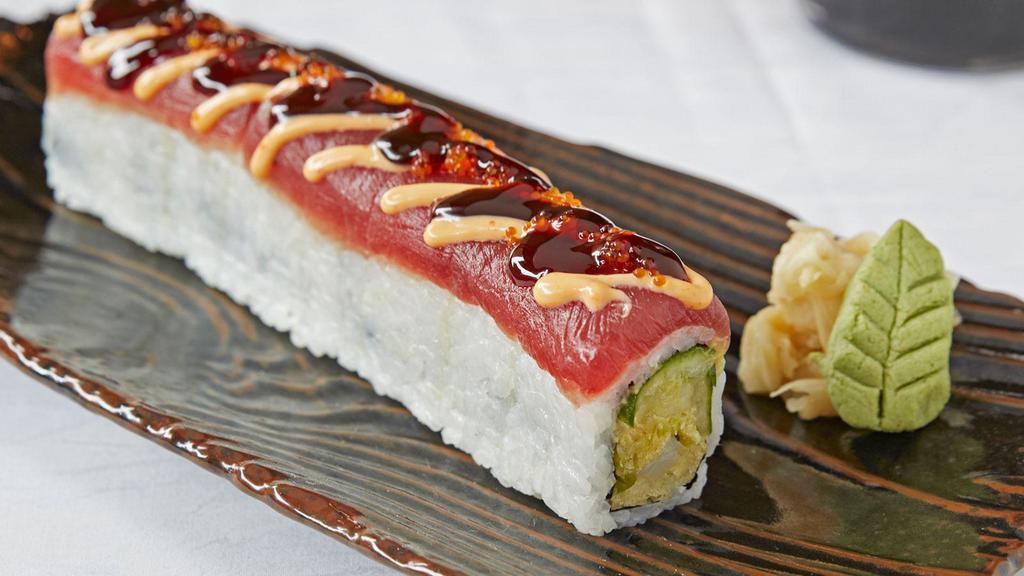 Playboy Roll · Tempura shrimp, avocado and cucumbers topped with tuna sashimi, sumo sauce, sweet sauce and tobiko.