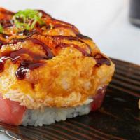 Lavish Roll · Tuna sashimi, avocado, cucumber and tempura asparagus topped with tiger prawns, crab salad, ...