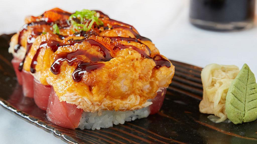 Lavish Roll · Tuna sashimi, avocado, cucumber and tempura asparagus topped with tiger prawns, crab salad, spicy aioli, sweet sauce and tobiko.