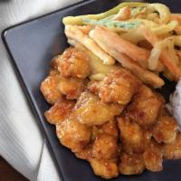 Sumo'S Orange Chicken New! · Delicious crispy chicken wok-tossed in our sweet and spicy sauce, served with steamed rice a...