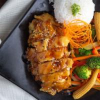 General Chong'S Chicken · Tempura white chicken breast basted with our house Korean BBQ sauce, served with steamed ric...