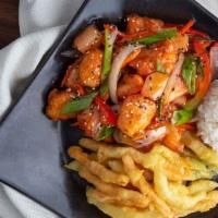 Sweet And Sour Chicken · Flash-fried white chicken breast with pineapple, green peppers and onions served with rice a...