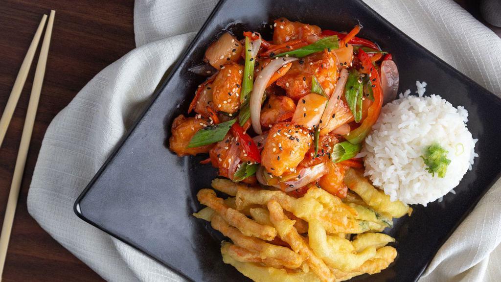 Sweet And Sour Chicken · Flash-fried white chicken breast with pineapple, green peppers and onions served with rice and sweet and sour sauce.