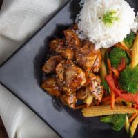 Teriyaki Tori · Bite size pieces of white chicken breast glazed with teriyaki sauce, served with steamed ric...