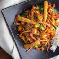 Thai Peanut Stir Fry · Tender white chicken breast and stir fried veggies on a bed of steamed rice, served with our...