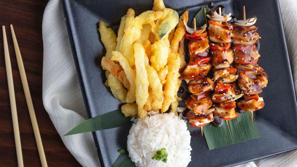 Grilled Chicken Satay · White chicken breast glazed with teriyaki sauce, served with steamed rice and your choice of stir fried or tempura veggies.