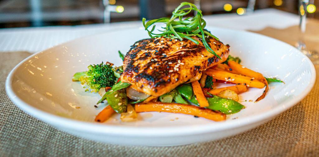 Miso Glazed Salmon · miso marinated fresh cut Verlasso salmon, pan seared & served on fresh
vegetable medley sautéed with sesame oil & ginger, garnished with scallion &
sesame seeds
