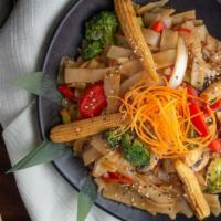 Siam Street Noodles · Spicy Asian flat noodles pan sautéed with Thai chilis, basil, garlic and seasonal veggies to...