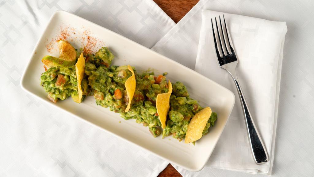 Chunky Guacamole · large fresh chunks of avocado mixed with lime, tomatoes, onions, and cilantro.