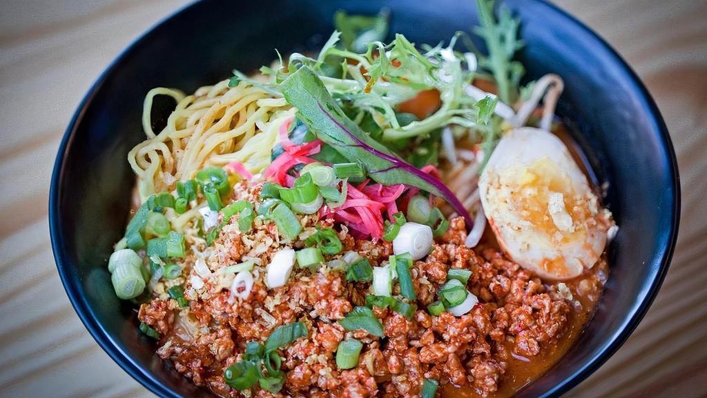 Tantan Men · Spicy ground pork, bean sprouts, spinach, scallions & soft boiled half egg in spicy miso broth over ramen