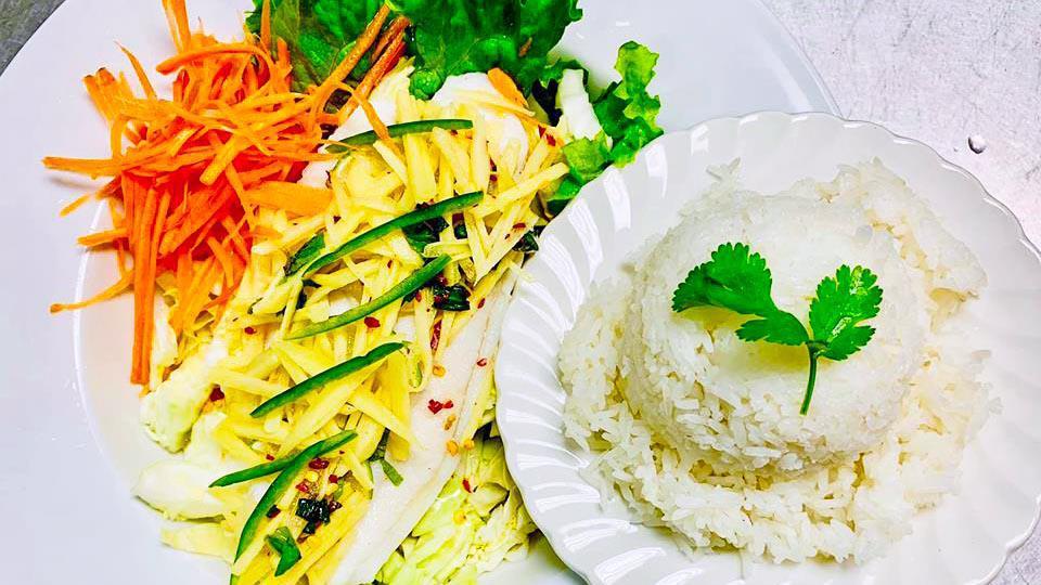 Lemon Fish · Fish fillet cooked in special lemon ginger sauce with cabbage, bell peppers, mint, fresh ginger, and green onion.