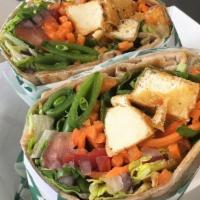 Tofu Wrap · Tofu, romaine lettuce, carrots, tomatoes, onions, cilantro, drizzled with a red curry lime s...