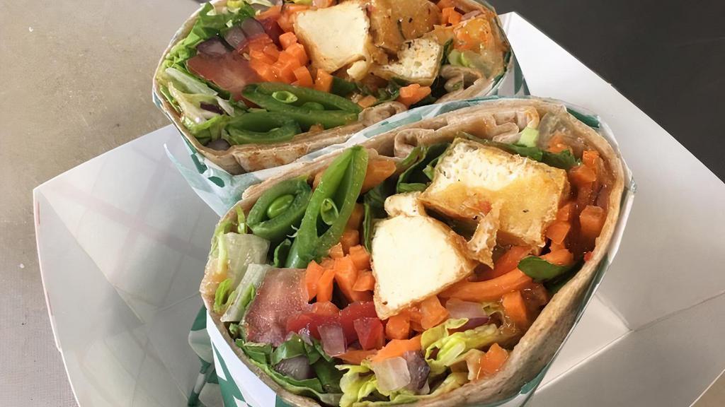 Tofu Wrap · Tofu, romaine lettuce, carrots, tomatoes, onions, cilantro, drizzled with a red curry lime sauce.