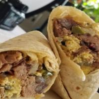 Breakfast Burrito · You can't mess with a classic. Scrambled eggs, melted cheese, breakfast potatoes, salsa, and...