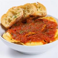 Cheese Ravioli · Extra-large pasta pillows filled with natural cheeses and topped with melted mozzarella, mar...