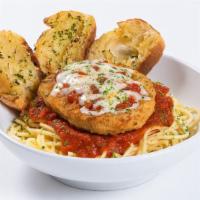 Chicken Parmesan · Spiced and breaded chicken parmesan on top of traditional Italian pasta. Baked with marinara...