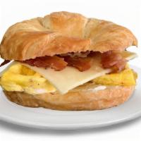 Croissant Breakfast Sandwich · Buttery  Croissant with melted cheese, crispy bacon, egg and mayo.

Breakfast never tasted s...