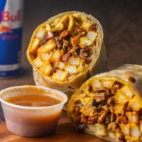The Munchies Burrito · A burrito filled with steak, pastor, fries, cheese sauce, pico de gallo, guacamole, crema, a...